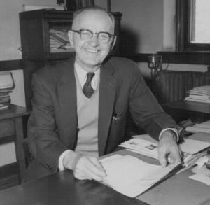 Gaffney BF smiling at desk